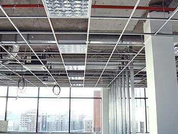View of an open ceiling at a commercial facility during a build-out